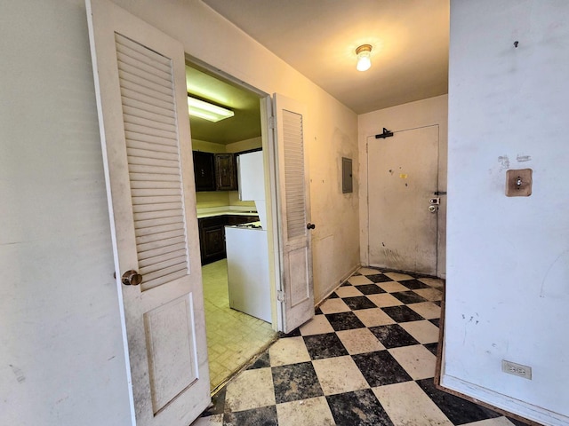 hall featuring light floors and electric panel