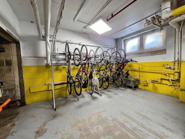 garage featuring bike storage and concrete block wall