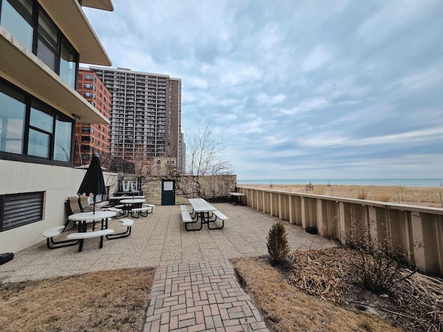 view of patio featuring a water view