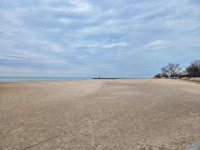 property view of water featuring a beach view