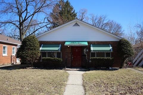 view of front of home with brick siding