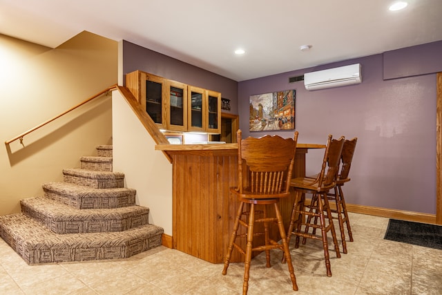 bar with baseboards, a wall mounted air conditioner, stairs, a bar, and recessed lighting