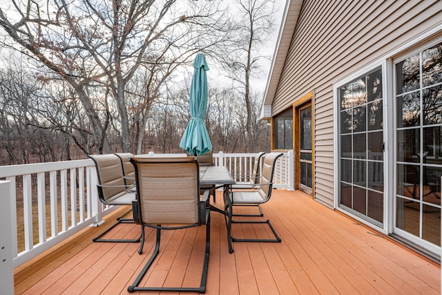 wooden terrace featuring outdoor dining space