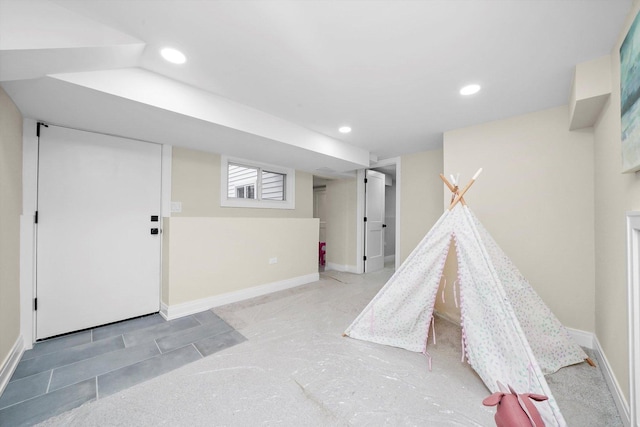 game room featuring baseboards, concrete floors, and recessed lighting