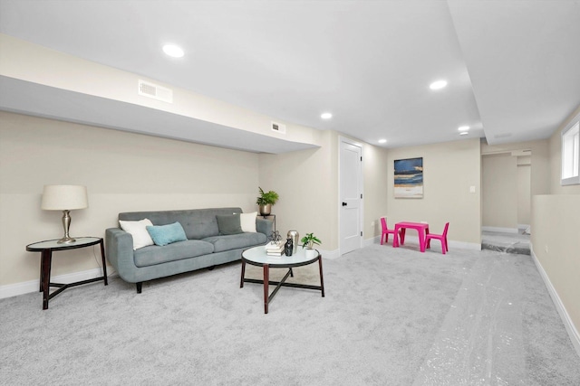 carpeted living room with baseboards, visible vents, and recessed lighting