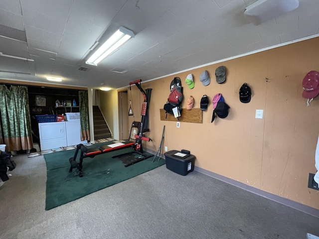 workout area with washer and clothes dryer