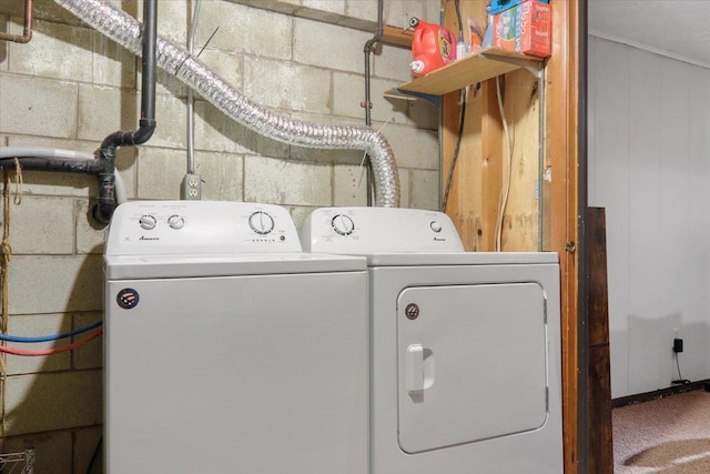 clothes washing area with separate washer and dryer