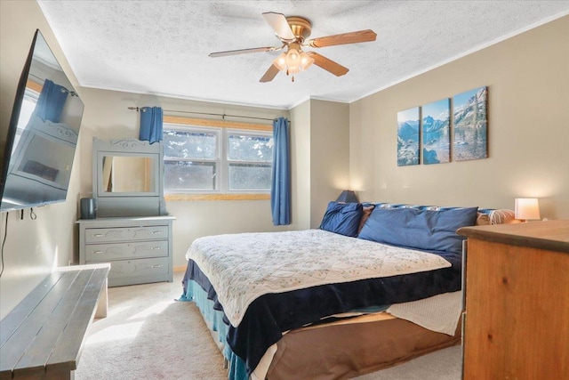 bedroom with light carpet, a textured ceiling, and ornamental molding