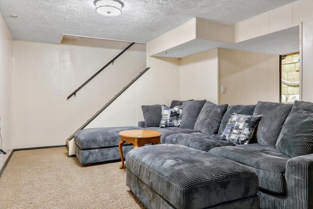 living room with a textured ceiling and carpet flooring