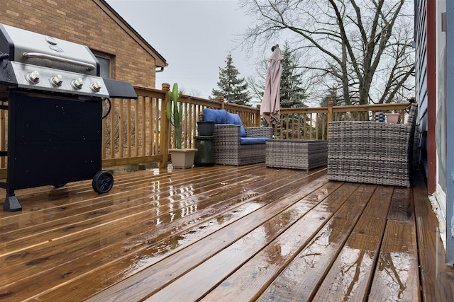 wooden terrace with a grill