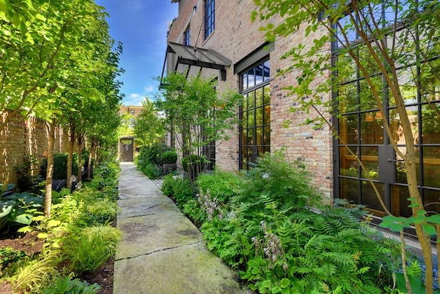 view of property exterior with brick siding