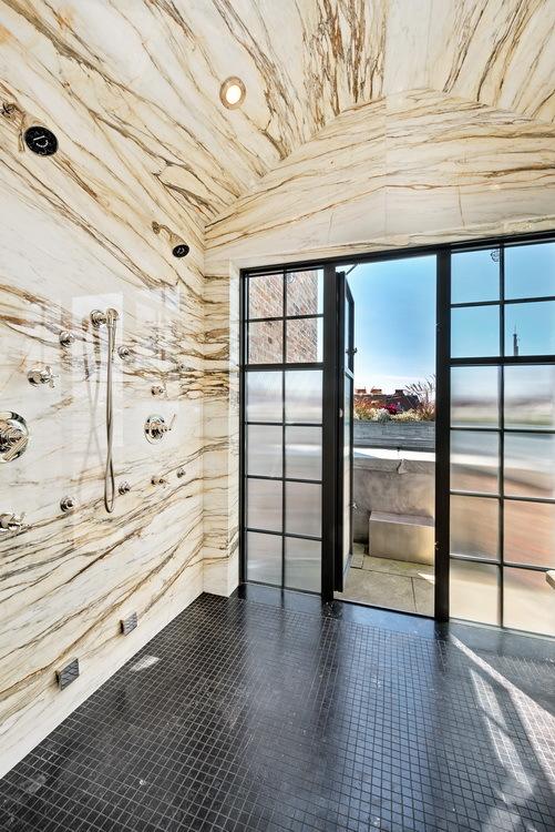 entryway featuring dark tile patterned floors