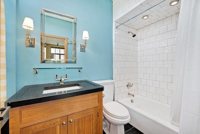 full bath with shower / bath combo, vanity, and toilet