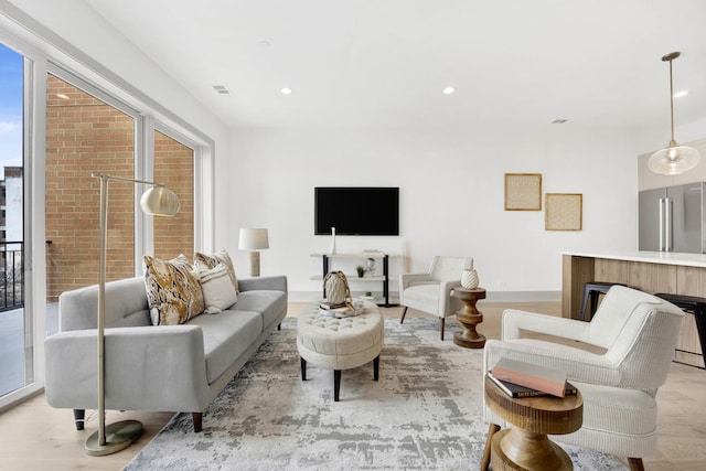 1548 W Ardmore Ave Unit 3F, Chicago, IL 60660 - living room with light wood-style floors, recessed lighting, and plenty of natural light