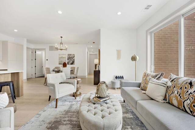 1548 W Ardmore Ave Unit 3F, Chicago, IL 60660 - living area with a chandelier, light wood-style flooring, and recessed lighting
