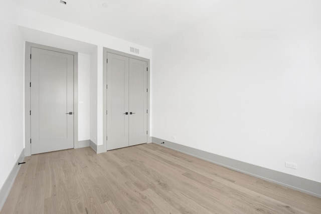 1548 W Ardmore Ave Unit 3F, Chicago, IL 60660 - unfurnished bedroom with light wood finished floors and baseboards