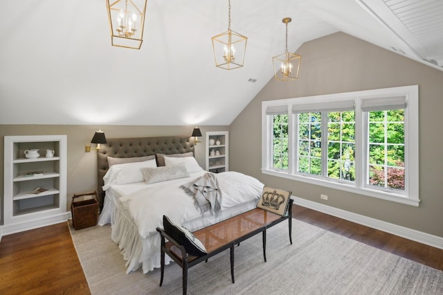 bedroom with lofted ceiling, wood finished floors, baseboards, and a chandelier