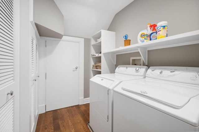 laundry room featuring laundry area, washer and dryer, and dark wood-type flooring