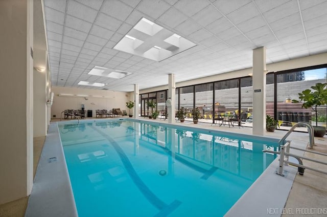 community pool featuring a skylight