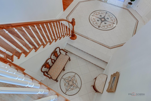 stairway featuring tile patterned floors