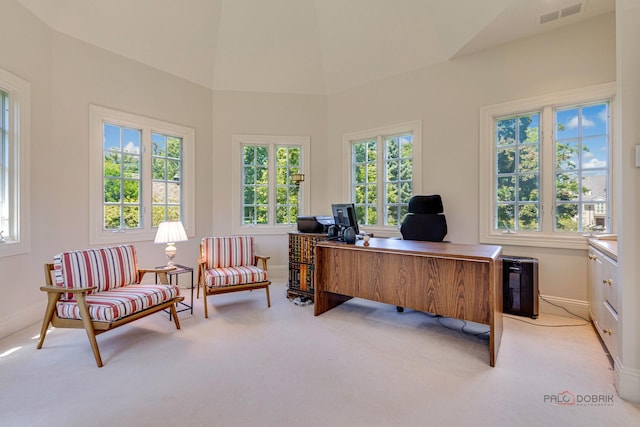 office with plenty of natural light, visible vents, baseboards, and light colored carpet