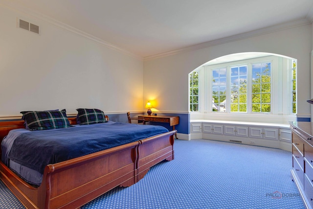 bedroom featuring carpet floors, visible vents, and ornamental molding