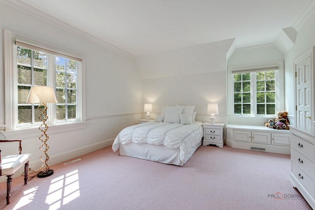 bedroom featuring multiple windows, visible vents, vaulted ceiling, and ornamental molding