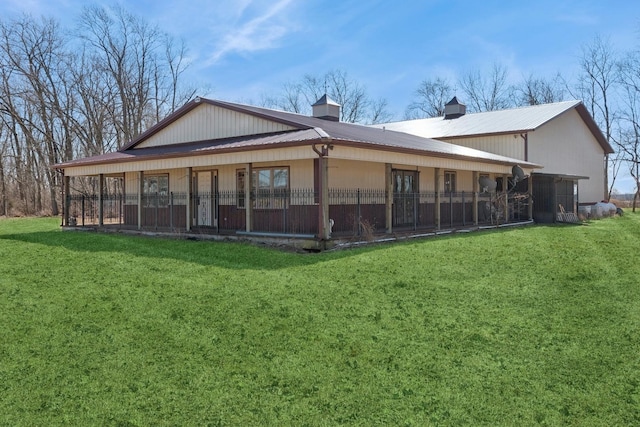 22915 Mcguire Rd, Wilmington, IL 60481 - rear view of property with a lawn and metal roof