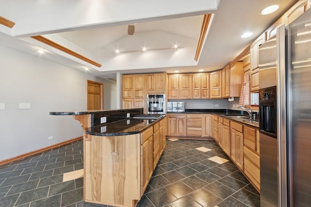 22915 Mcguire Rd, Wilmington, IL 60481 - kitchen with oven, a breakfast bar area, a tray ceiling, fridge with ice dispenser, and a sink