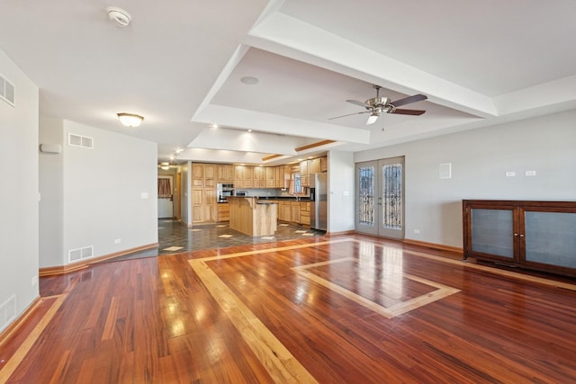 22915 Mcguire Rd, Wilmington, IL 60481 - unfurnished living room with visible vents, wood-type flooring, and baseboards