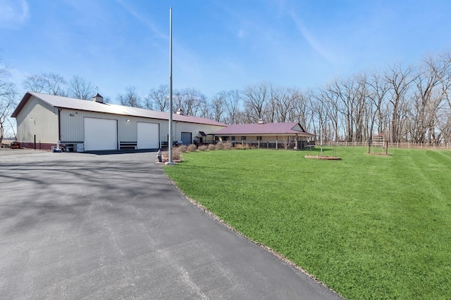 22915 Mcguire Rd, Wilmington, IL 60481 - view of front of home with a front yard, an outbuilding, and a chimney