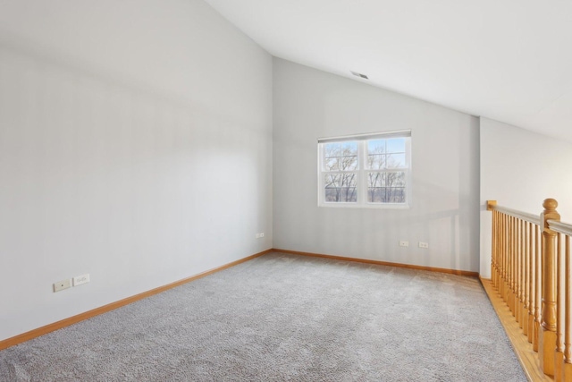 bonus room featuring carpet flooring, visible vents, baseboards, and vaulted ceiling