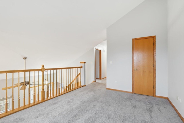 bonus room with baseboards, carpet, and vaulted ceiling