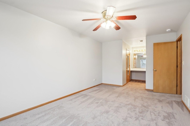 unfurnished bedroom with visible vents, a ceiling fan, ensuite bath, carpet, and baseboards