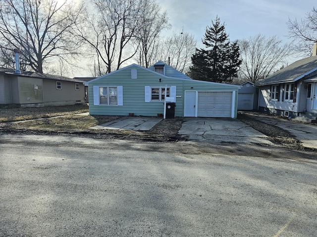 view of front of home featuring driveway and an attached garage