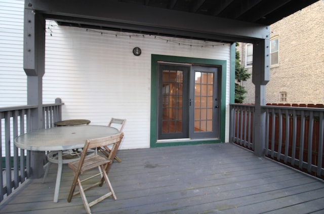 deck with outdoor dining area