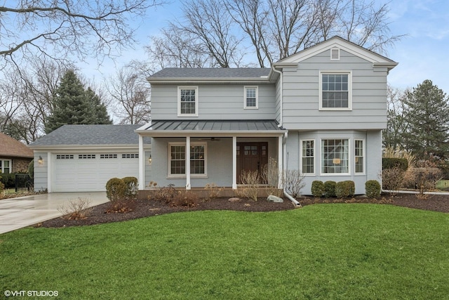 traditional home with brick siding, a front yard, covered porch, a garage, and a standing seam roof