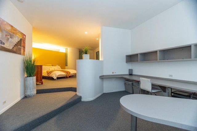 office with recessed lighting, carpet, baseboards, and built in study area