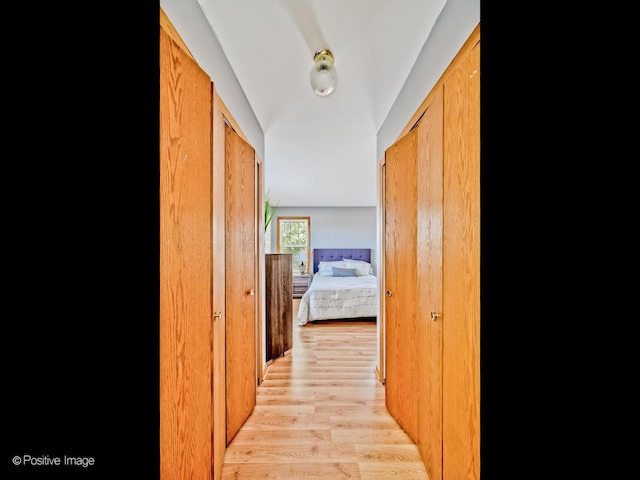 corridor with light wood-type flooring