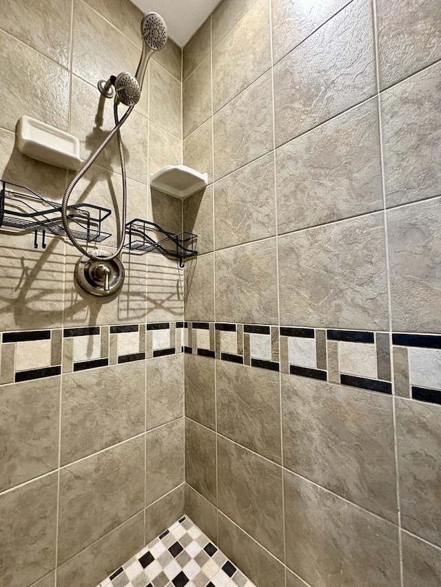 details with a tile shower