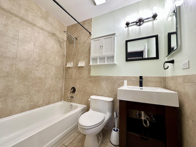 bathroom featuring toilet, tile patterned flooring, tile walls, and bathing tub / shower combination