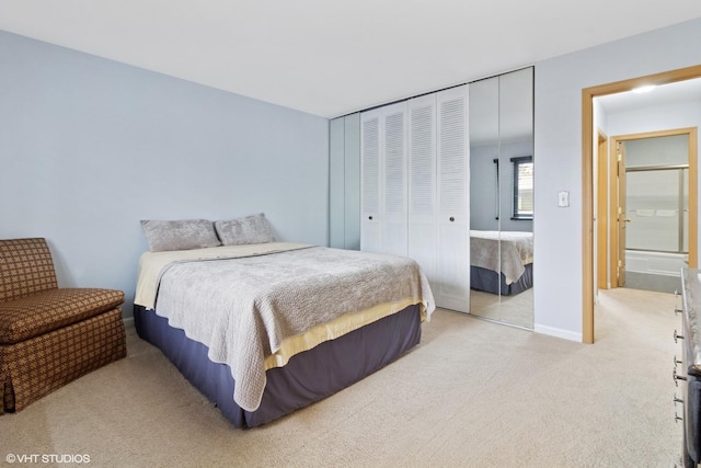 bedroom featuring a closet, baseboards, and carpet flooring