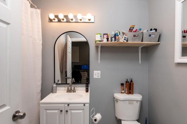 full bathroom featuring vanity and toilet