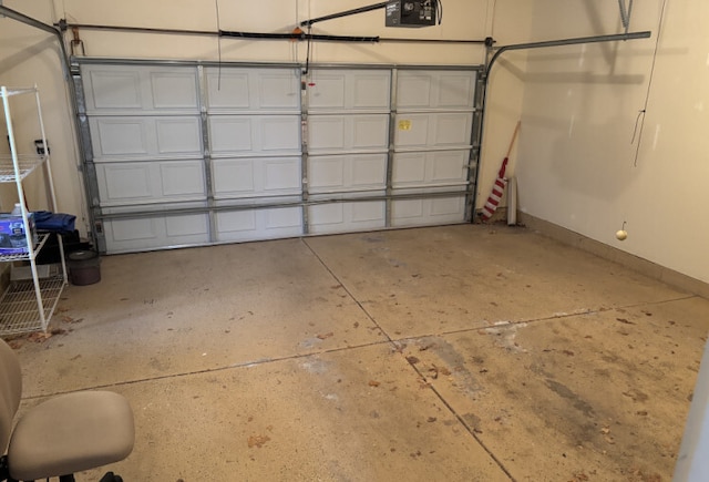 garage featuring baseboards and a garage door opener