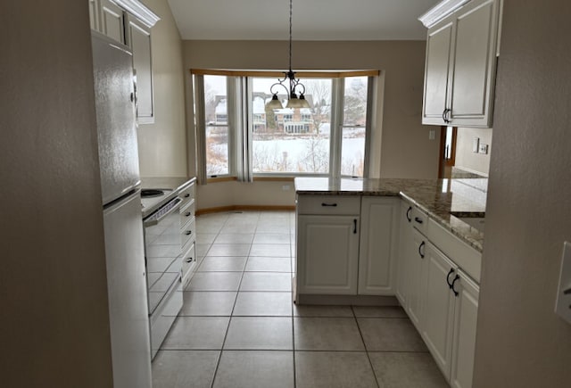 kitchen featuring decorative light fixtures, light tile patterned floors, white range with electric cooktop, white cabinetry, and a peninsula