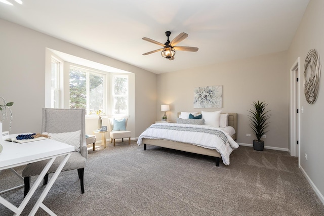 bedroom with baseboards, carpet, and a ceiling fan