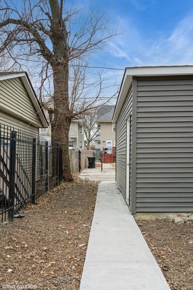 view of home's exterior featuring fence