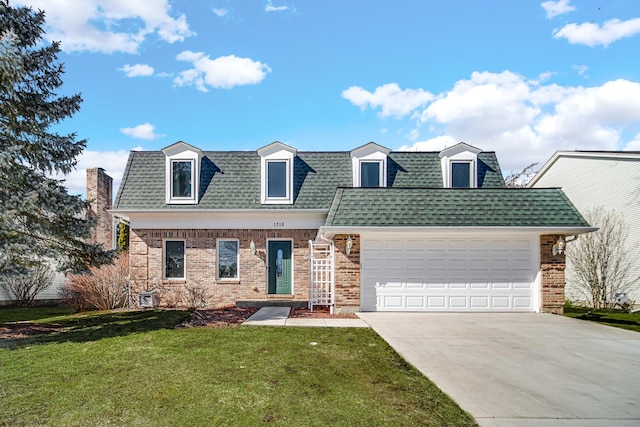 view of front of home featuring driveway, a garage, a shingled roof, a front lawn, and brick siding