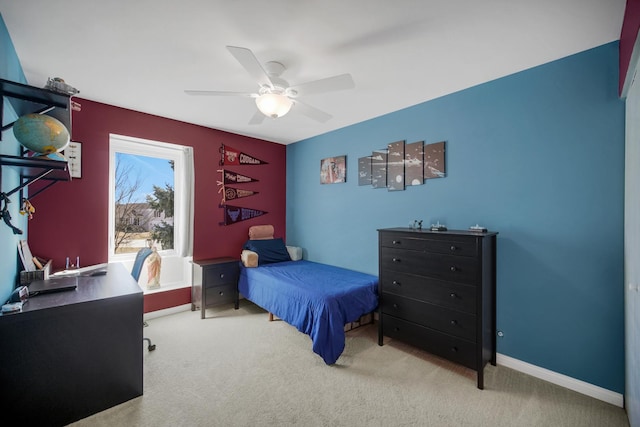 bedroom featuring a ceiling fan, baseboards, and carpet flooring