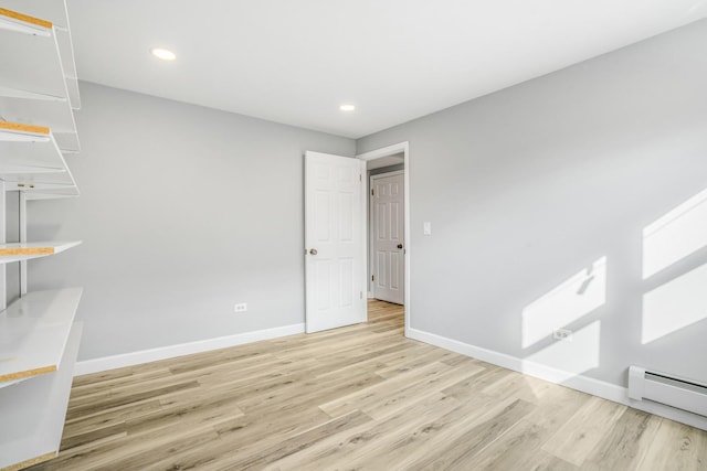 unfurnished room with light wood-style floors, recessed lighting, baseboards, and baseboard heating